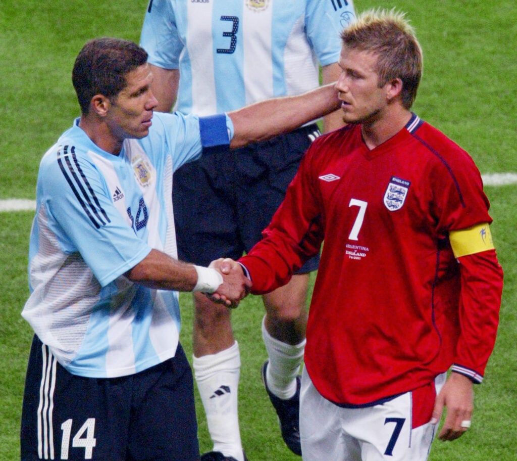 English captain and midfielder David Beckham (R) s