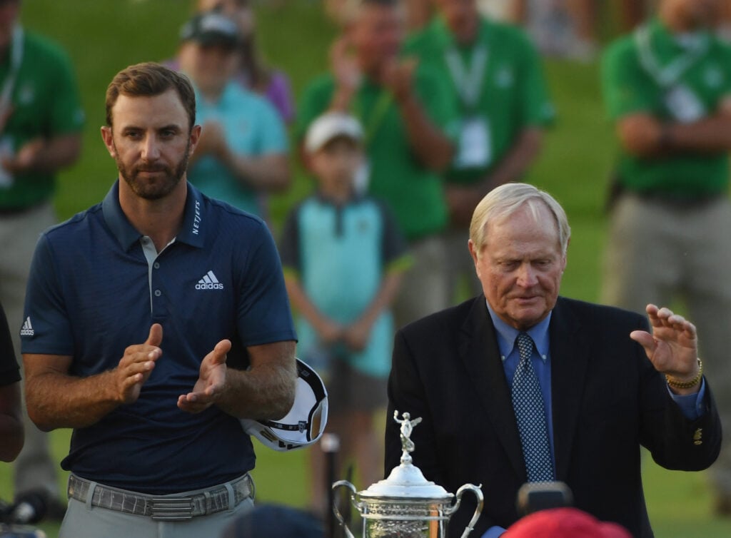Dustin Johnson celebrates alongside Jack Nicklaus after winning the U.S. Open at Oakmont Country Club