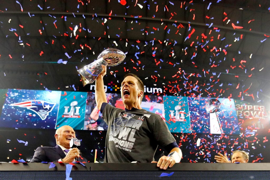 Tom Brady #12 of the New England Patriots celebrates with the Vince Lombardi Trophy after defeating the Atlanta Falcons during Super Bowl 51 at NRG Stadium on February 5, 2017 in Houston, Texas. The Patriots defeated the Falcons 34-28