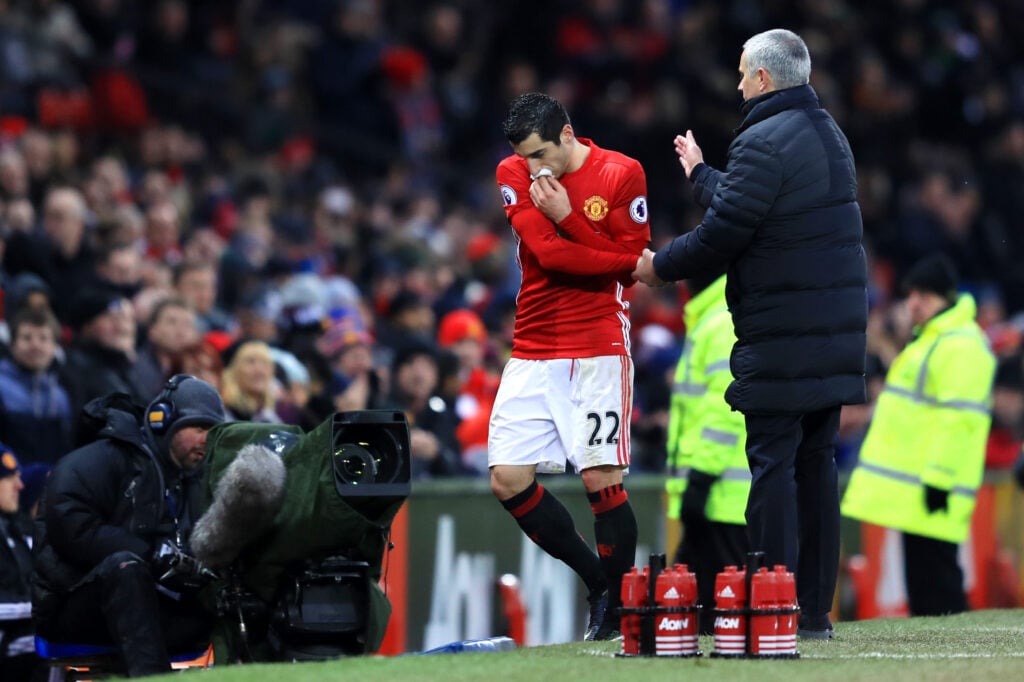 Henrikh Mkhitaryan of Manchester United shakes hands with manager Jose Mourinho after being substituted during the Premier League match between Manchester United and Watford at Old Trafford on February 11, 2017 in Manchester, England.
