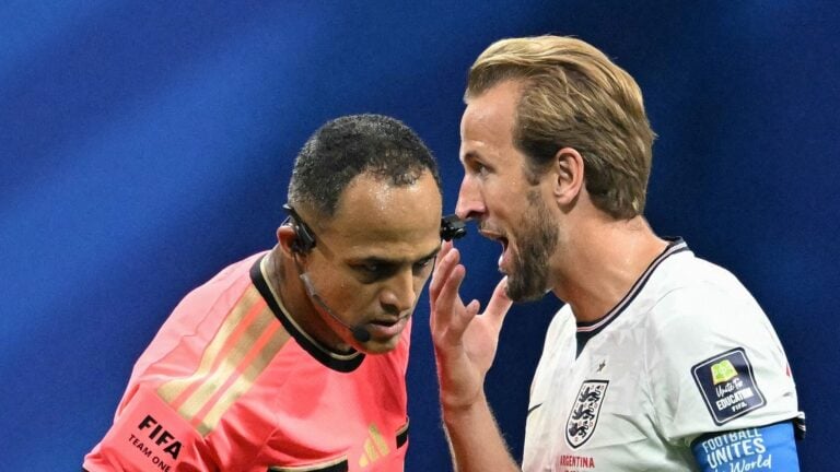 Harry Kane speaks to the referee following a foul during England vs Argentina