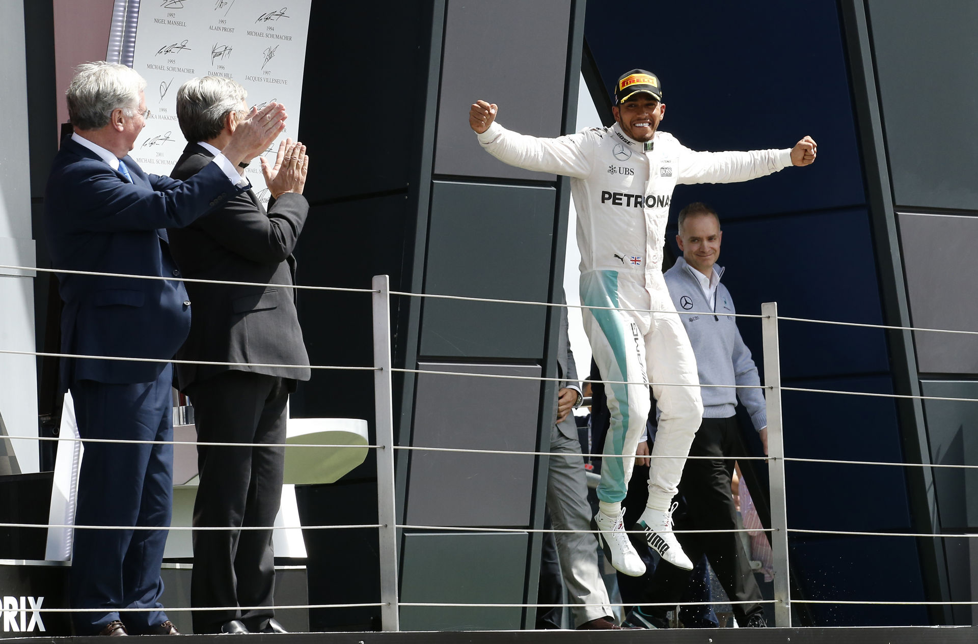 Mercedes' Lewis Hamilton celebrates after winning the race (REUTERS)